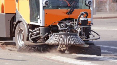 Municipal car for cleaning roads and sidewalks outdoors